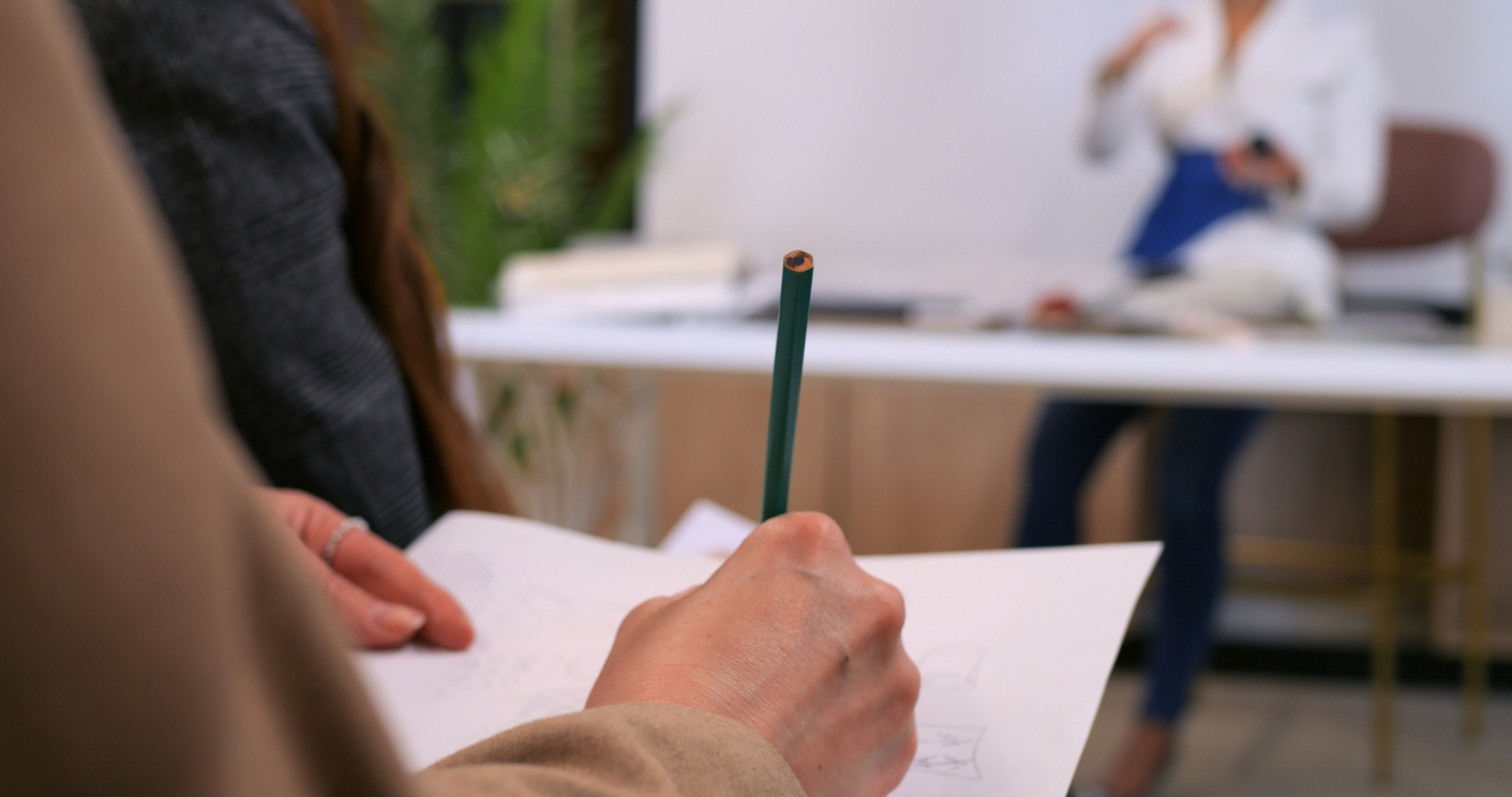 Seminar attendee taking detailed notes. Engaged student, trendy fashion insights, immersive learning. Capturing creativity, new ideas fashion trends. Educational inspiring, informative