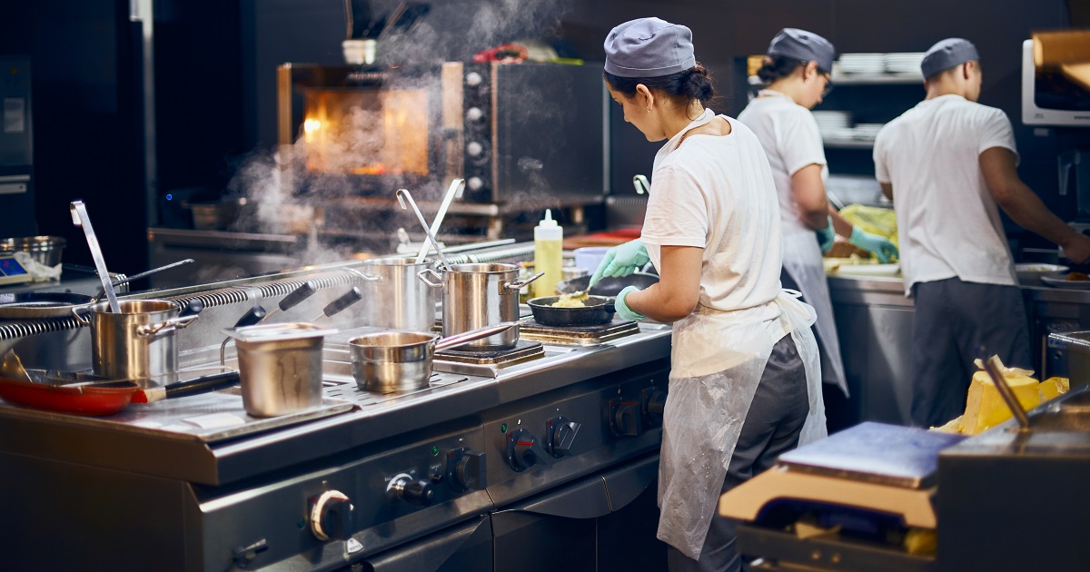 Kitchen staff prepares food in a restaurant