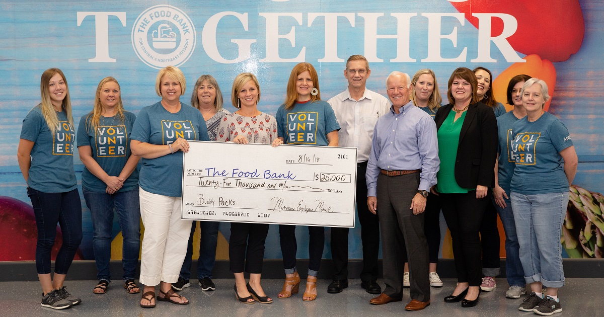 MEM employees present donation check to The Food Bank for Central and Northeast Missouri